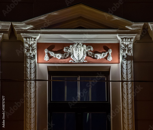 Modern illuminated residential building. Detail of exterior.