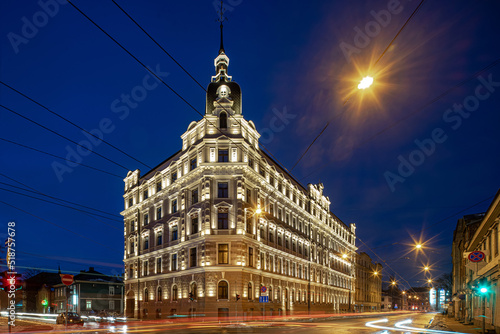 Fototapeta Naklejka Na Ścianę i Meble -  Night cityscape of Riga. Lights on long exposure. Illuminated building