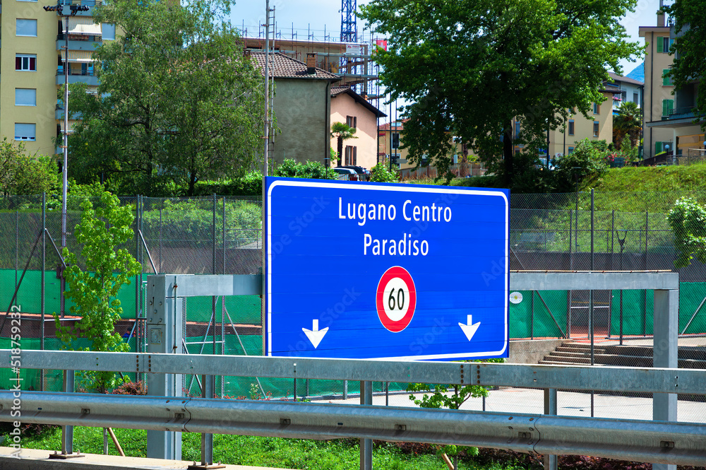 Obraz premium Lugano, Switzerland - June 4, 2022: Traffic sing on the main road leading to Lugano Center and Paradiso, Switzerland