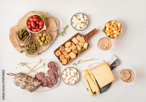 Appetizers table with different antipasti, charcuterie, snacks, cheese. Finger food for buffet party. Traditional french or italian entires. Top view © netrun78