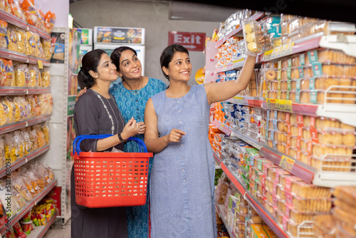 Photography Women shopping together in supermarket