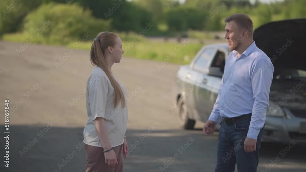 the car broke down on the road, a woman and a man are arguing the car broke down on the road, a woman and a man are arguing