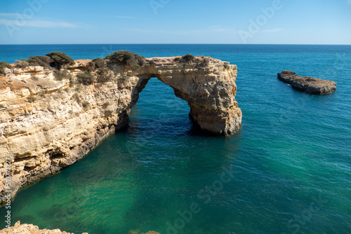 Natural Arch of Albandeira during low tide. Landmark in Lagoa, Algarve.