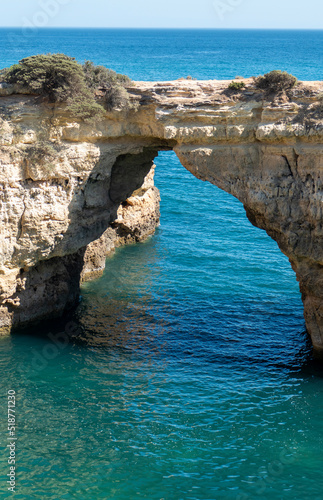 Natural Arch of Albandeira during low tide. Landmark in Lagoa, Algarve.