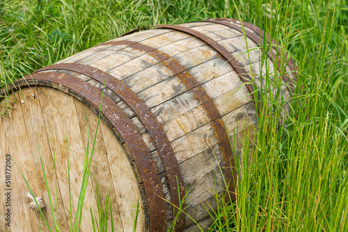old wooden barrel on the grass