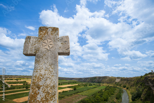 a cross above the valley by old Orhei (Orheiul Vechi), Moldova photo