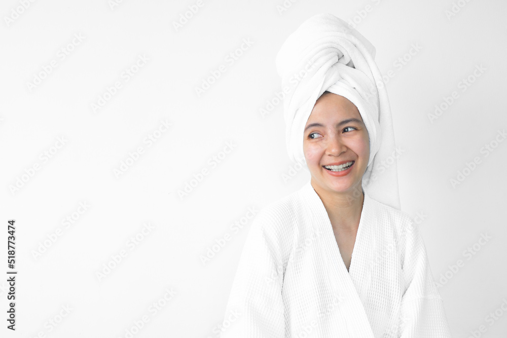 Beautiful Asian woman wearing bathrobe on white background, Face care, Skin care, Facial treatment, Cosmetology, beauty and spa Concept. Beautiful Asian woman wearing bathrobe on white background, Face care, Skin care, Facial treatment, Cosmetology, beauty and spa Concept.