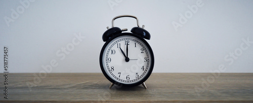 Analog alarm clock pointing at hours, minutes, seconds to display time - Photo of digital timer for website, deadline, illustration, banner, meeting - 11 am 11 pm 11am 11pm 23h 23