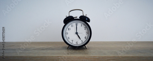 Analog alarm clock pointing at hours, minutes, seconds to display time - Photo of digital timer for website, deadline, illustration, banner, meeting - 5 am 5 pm 5am 5pm 17h 17