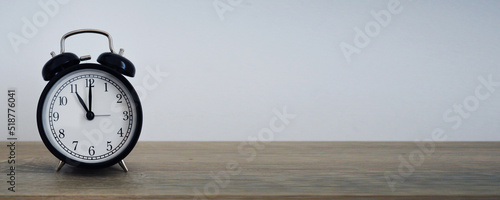 Analog alarm clock pointing at hours, minutes, seconds to display time - Photo of digital timer for website, deadline, illustration, banner, meeting - 11 am 11 pm 11am 11pm 23h 23