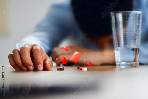 Stressed man taking pills from drugs relieve symptoms, depression, pain relief, headache concept. 
