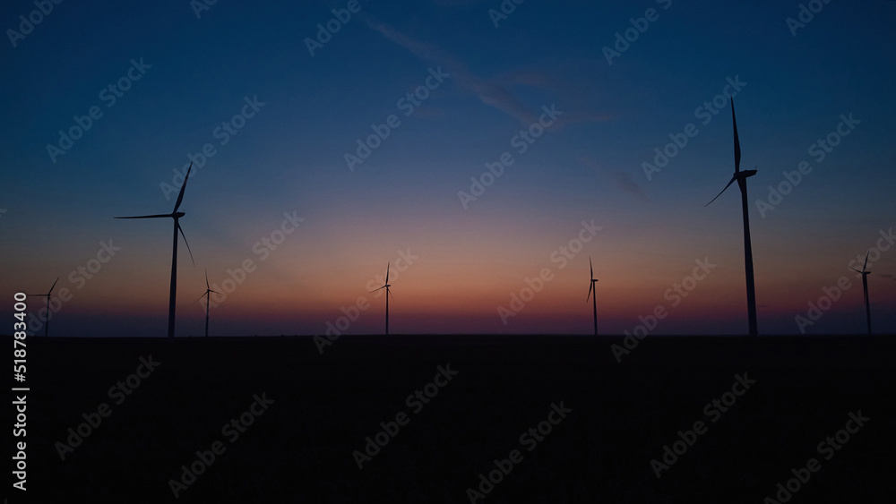 Fototapeta premium Windmill farm park and turbines for producing green electricity.