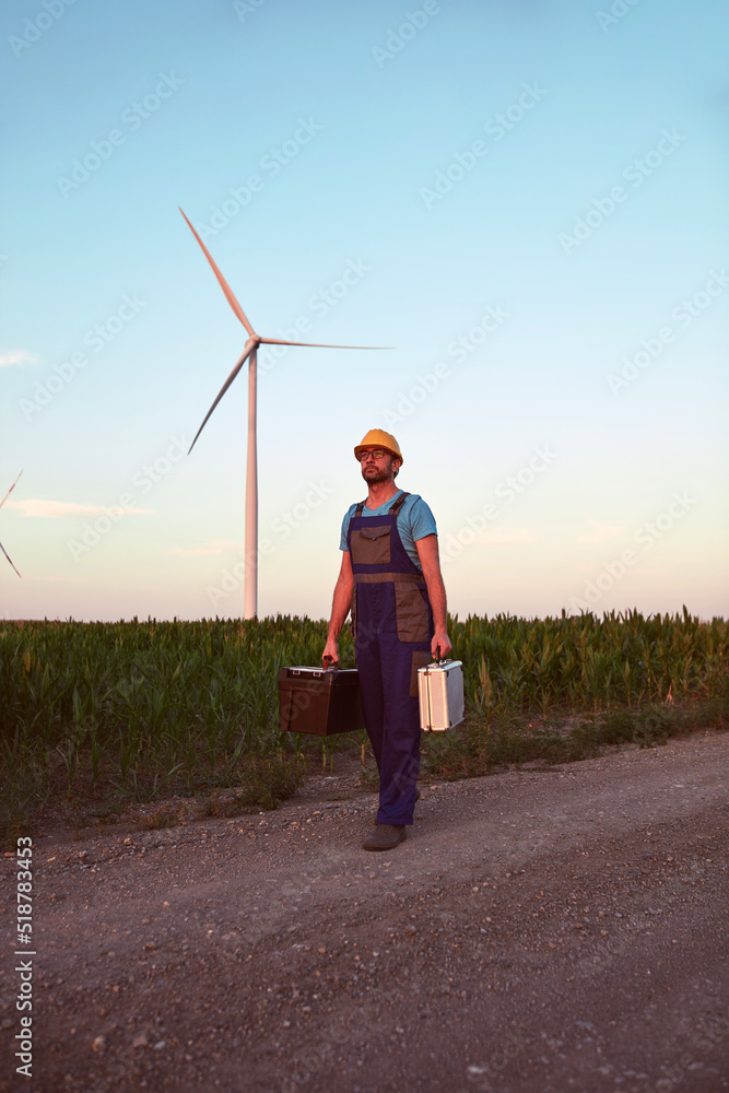 custom made wallpaper toronto digitalEngineer mechanic in a windmill farm park checking and servicing wind turbines.