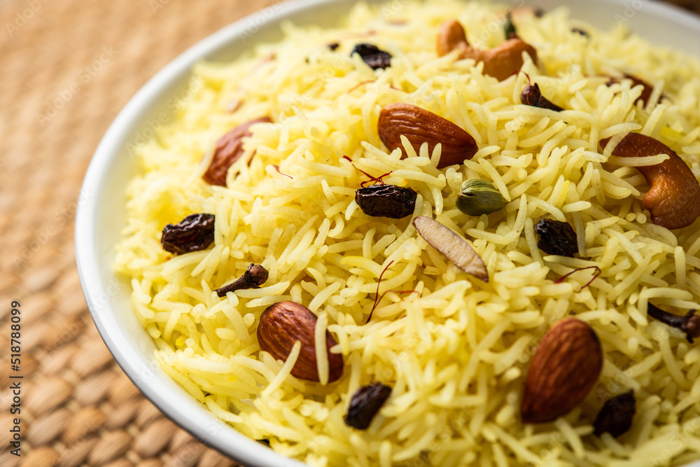 Kashmiri sweet modur pulao made of rice cooked with sugar, water flavored with Saffron and dry fruits Kashmiri sweet modur pulao made of rice cooked with sugar, water flavored with Saffron and dry fruits