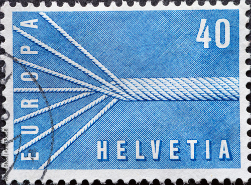 SWITZERLAND - CIRCA 1957: a postage stamp from SCHWEIZ , showing a seven-core symbolic rope with text: Europe . Circa 1957. photo