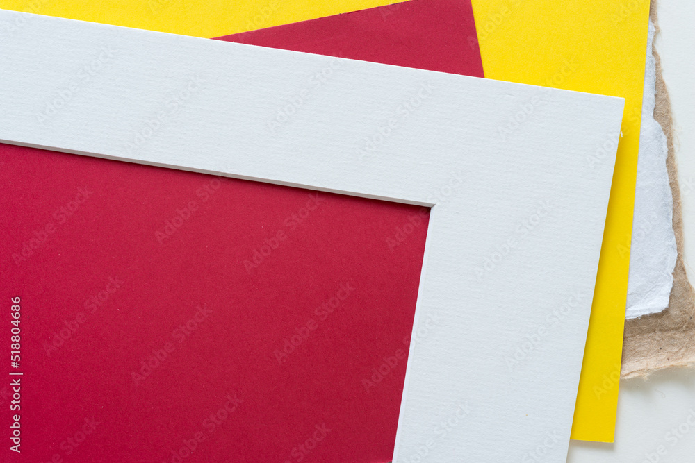 Fototapeta premium white paper frame with yellow and red paper