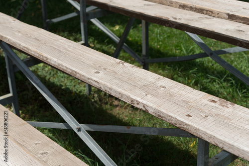 wooden benches at a baseball diamond in summer © eugen