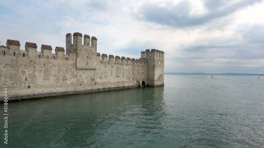 The walls of the Scaligera Castle in Sirmione on the Lake Garda, Italy The walls of the Scaligera Castle in Sirmione on the Lake Garda, Italy