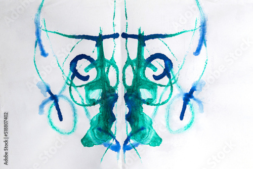 Abstract ink blot test used in psychoanalysis. Colorful symmetric shapes on white background for interpretation. Rorschach test