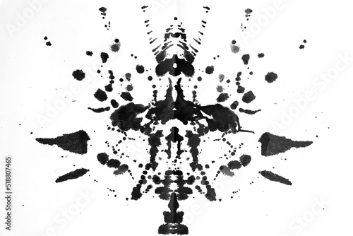 Ink blot test - Rorschach test used in Psychoanalysis. Dark grey, symmetric, mirror images made of granulated ink on white background