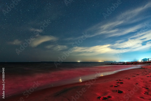 View of the sea on a moonlit night made with long exposure. Night sky. Stars. Ochakov. Ukraine photo