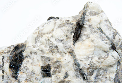 biotite mineral in a rock over white background photo