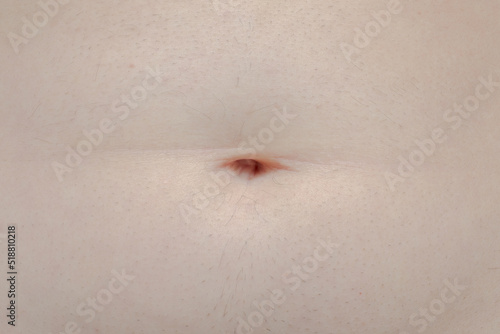 belly button on a man's stomach