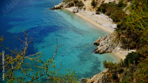 Fototapeta Naklejka Na Ścianę i Meble -  Crystal clear waters with sandy beaches and secluded bays.Along the Ionian coast is the most beautiful sea where the rugged coast offers magnificent bays with sandy or pebble beaches with a blue-green