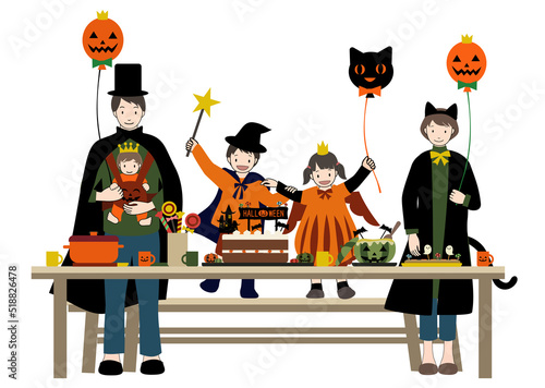 楽しそうに笑顔でハロウィンパーティーをする家族