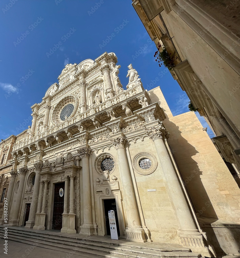 Basilicata di Santa Croce in Lecce, Puglia Façade detail of Baroque architecture style of  17th century against blue sky