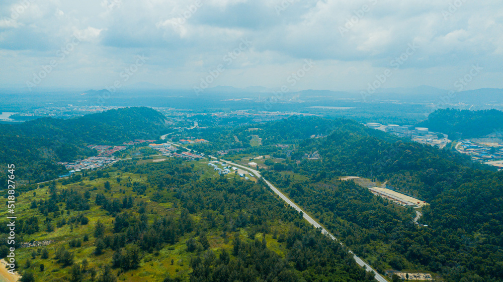 Aerial drone view of rural area and a road in Pantai Marina Telaga Simpul, Kemaman, Terengganu, Malaysia.