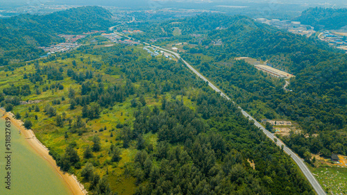 Aerial drone view of rural area and a road in Pantai Marina Telaga Simpul, Kemaman, Terengganu, Malaysia. photo