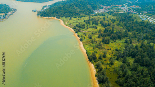 Aerial drone view of shoreline scenery in Pantai Marina Telaga Simpul, Kemaman, Terengganu, Malaysia.