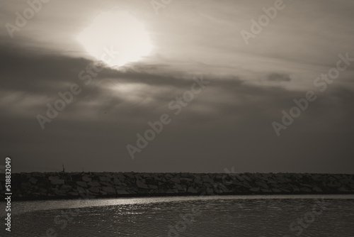 sunset over the sea with black and white photo