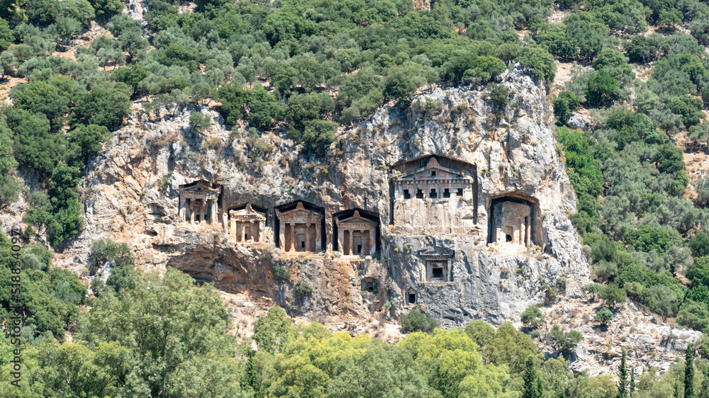 Kings tombs carved caves in the cliff face Kaunos Dalyan, Turkey. Lycian Tombs of ancient Caunos town.