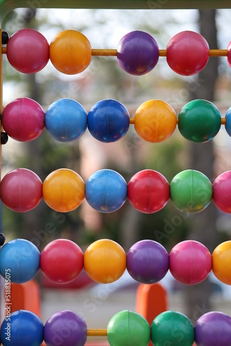 close up of colorful balls in park photo