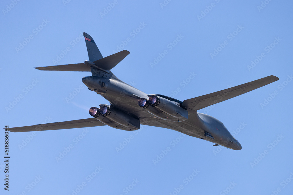 Close tail view of a B-1 Lancer bomber  with afterburners on