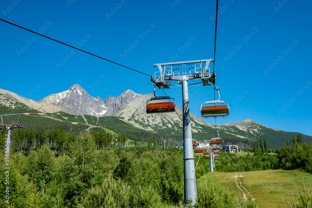 Chair lift for tourists and skiers in the High Tatras, rocky lake