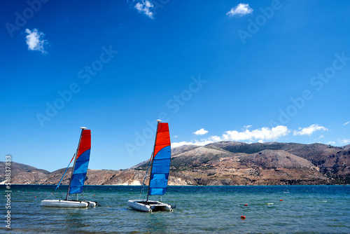 sailboats - catamarans moored in the sea bay on the island of Kefalonia