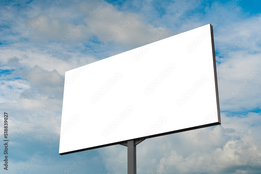 Mock up - blank white billboard or large advertising display against blue sky with white clouds. Consumerism, white screen, template, mock up and copy space concept Mock up - blank white billboard or large advertising display against blue sky with white clouds. Consumerism, white screen, template, mock up and copy space concept
