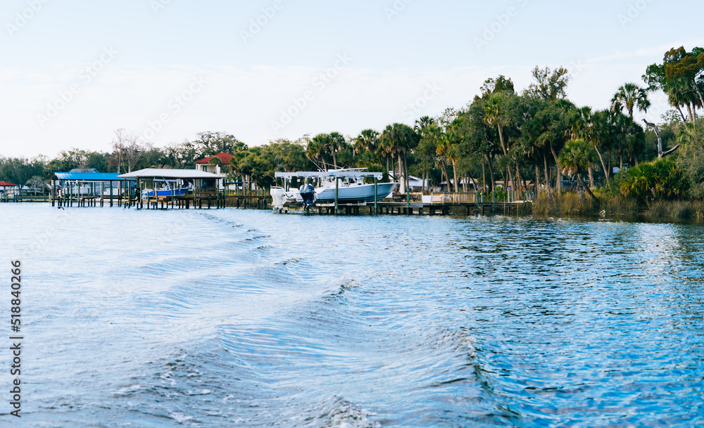 Obraz premium Riverview, Florida, USA - 02 10 2022: River view house and dock along Little Manatee River 
