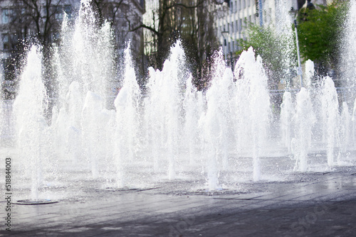 Fountains in Manchester Piccadilly Gardens on a bright sunny day