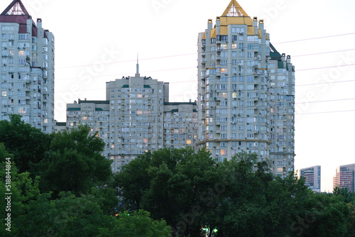 Huge residential buildings in the park. City. Landmark. Dwelling. Estate. Large. Property. Public. Recreation. Residence. Rich. Gardening. Family. Design. Construction