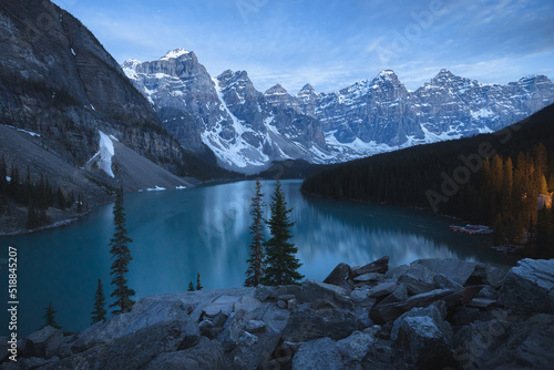 Twilight or blue hour view at night of Moraine Lake landscape, a popular tourist destination in Banff National Park, Alberta, Canada in the Rocky Mountains.