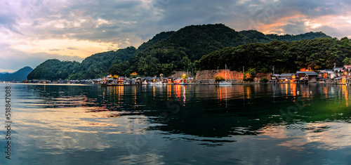 Panoramic view of dramatic sunset over quiet coastal village of Ine, Kyoto