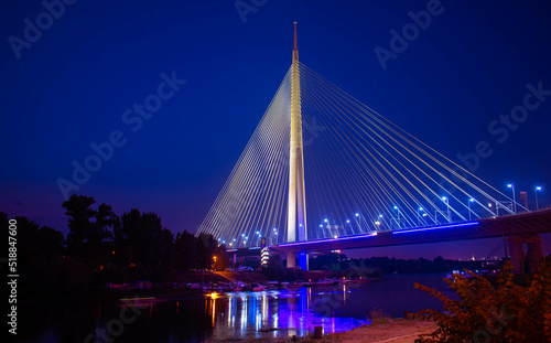 Ada Bridge in Belgrade Serbia nightscape with Sava river marina in front