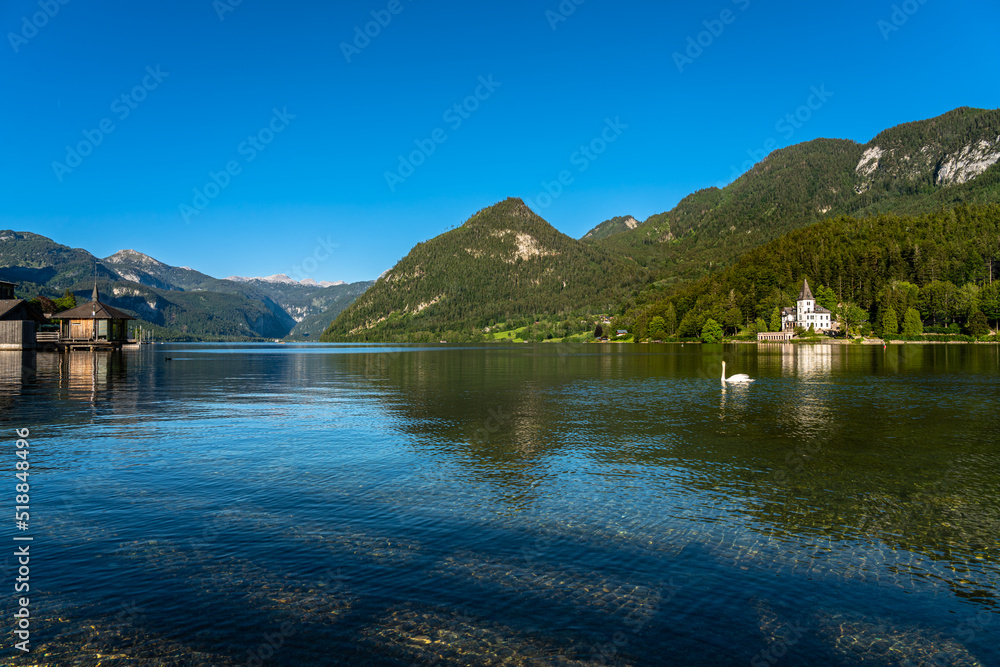 Stunning panorama view of Grundlsee lake with mountain peaks of Styrian Alps in background on a sunny summer day, Ausseerland - Salzkammergut region, Styria, Austria