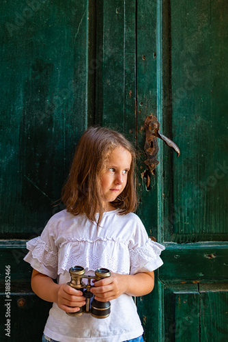 Photography Little cute girl  posing in the street of Rovinj, Croatia.