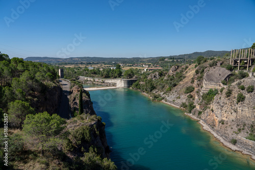 spillway below El Grado Dam, Hydro-Electricity Generation, Huesca, Spain, a concrete hydro-electric reservoir dam, clear blue sky