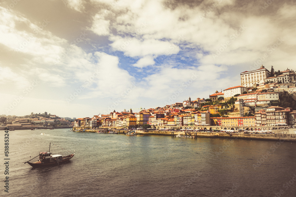 Fototapeta premium Porto, Portugal, old town cityscape and the Douro River with traditional Rabelo boats